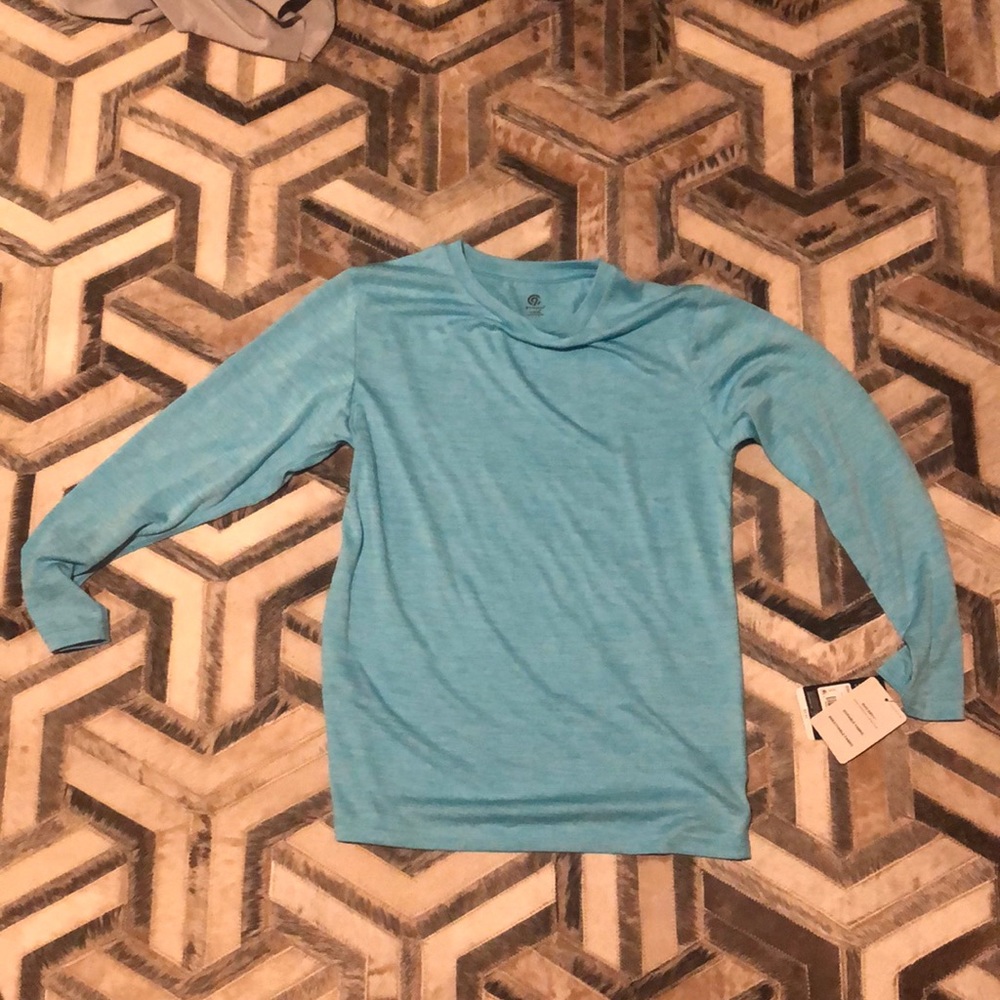 Blue shirt with thin, quick dry material.